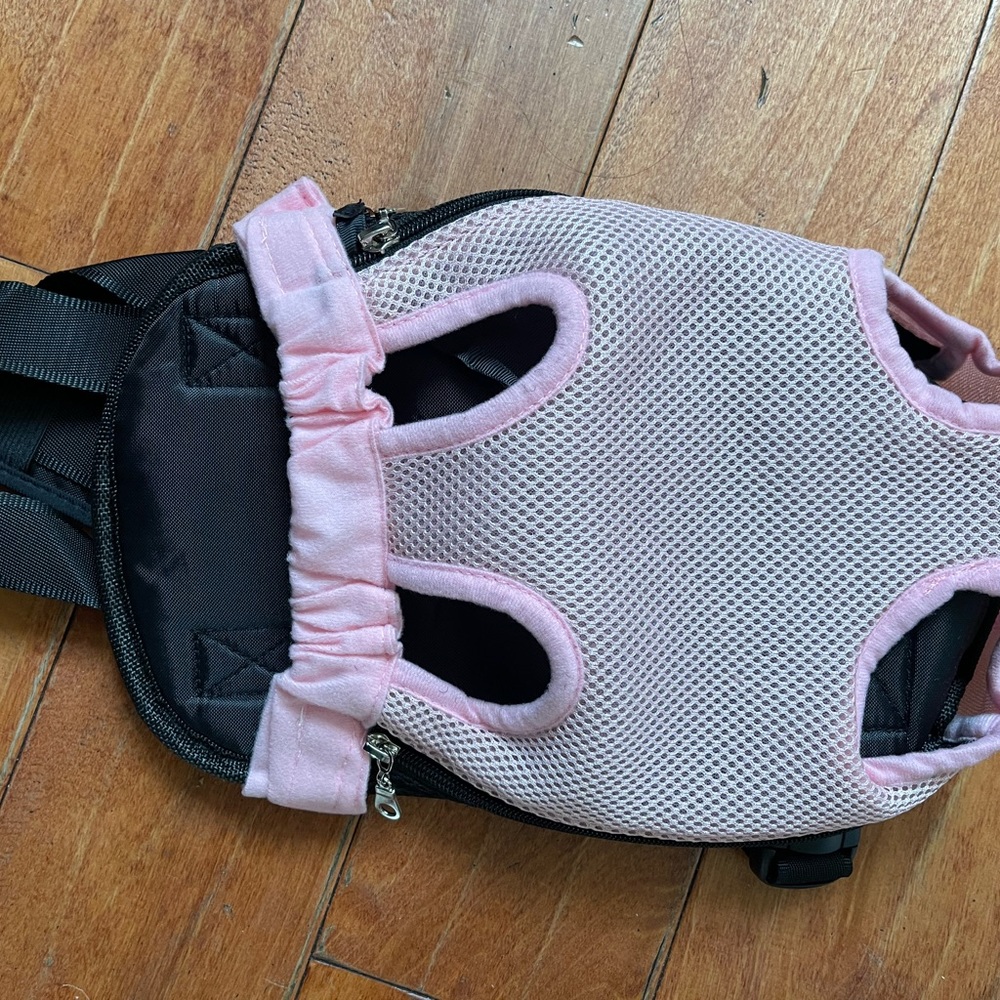 Dog carrier.  You can hang them on the front or the back. Medium.